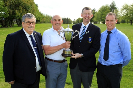 Billy Donlon (Birr) receiving the Munster Seniors trophy from Jim Long, Chairman Munster Golf. Also included are Bernard Hanrahan, Captain Ennis Golf Club and Patrick Treacy from Treacy's West County Hotel Ennis. Picture: Niall O'Shea